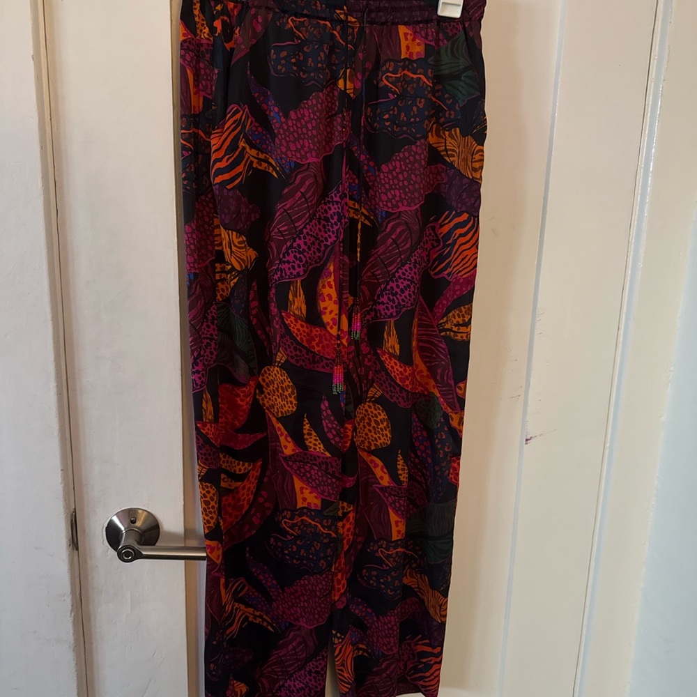 Vibrant Multicolor women’s pants. Hole on leg